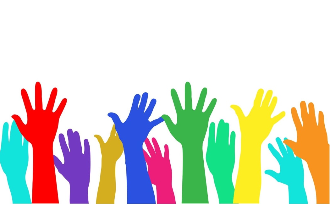 Hands in the air voting.