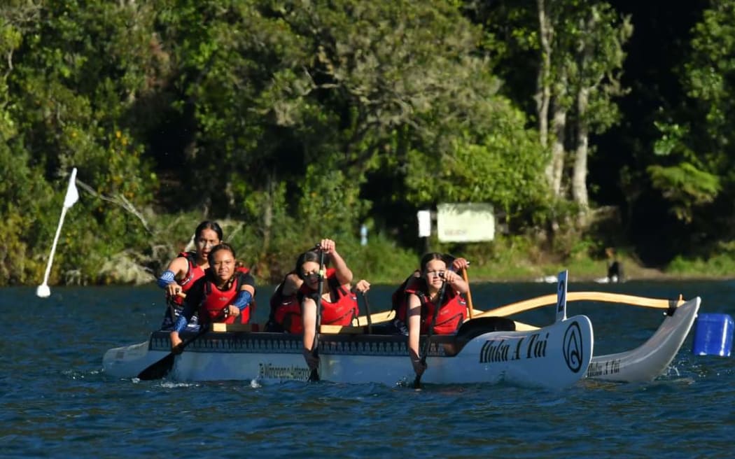Tauranga Girls' College students in action at the Secondary School Waka Ama Nationals on Blue Lake in Rotorua.