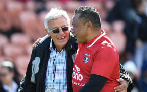 Former All Blacks Sir Bryan Williams and Ofisa Tonu'u catch up after the New Zealand Barbarians Legends v Pacific Legends game in 2019.