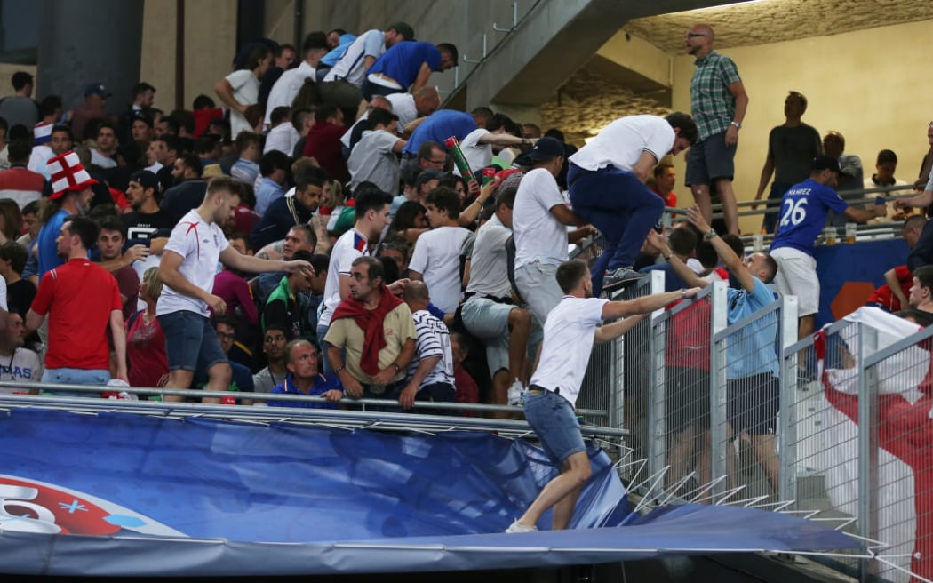 English football fans leave the stadium after the UEFA Euro 2016 group stage match between the English and Russian national teams.
