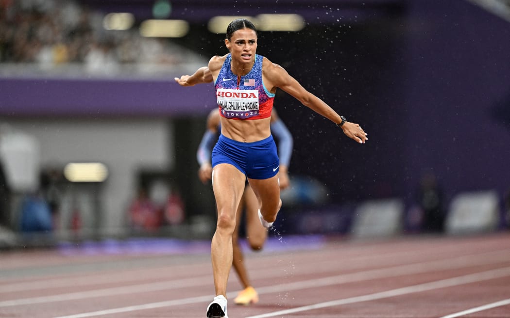 Sydney McLaughlin-Levrone crosses the finish line to win in the women's 400m final during the World Athletics Championships in Tokyo on September 18, 2025. (Photo by Jewel SAMAD / AFP)