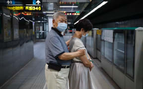 The daily routine of citizens who travel using the underground service MRT during peak hours in the evening in the capital, under the Covid-19 pandemic, Taipei City, Taiwan, 27 July 2020. (Photo by Ceng Shou Yi/NurPhoto)