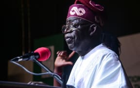 Nigeria's President-elect Bola Tinubu sits at the International Centre waiting to receive his certificate of return by the Independent National Electoral Commission (INEC) in Abuja on March 1.