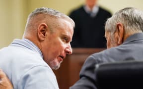 Colin Gray listens to his attorney during closing arguments in his trial at Barrow County Courthouse in Winder, GA, on Monday, 2 March 2026.