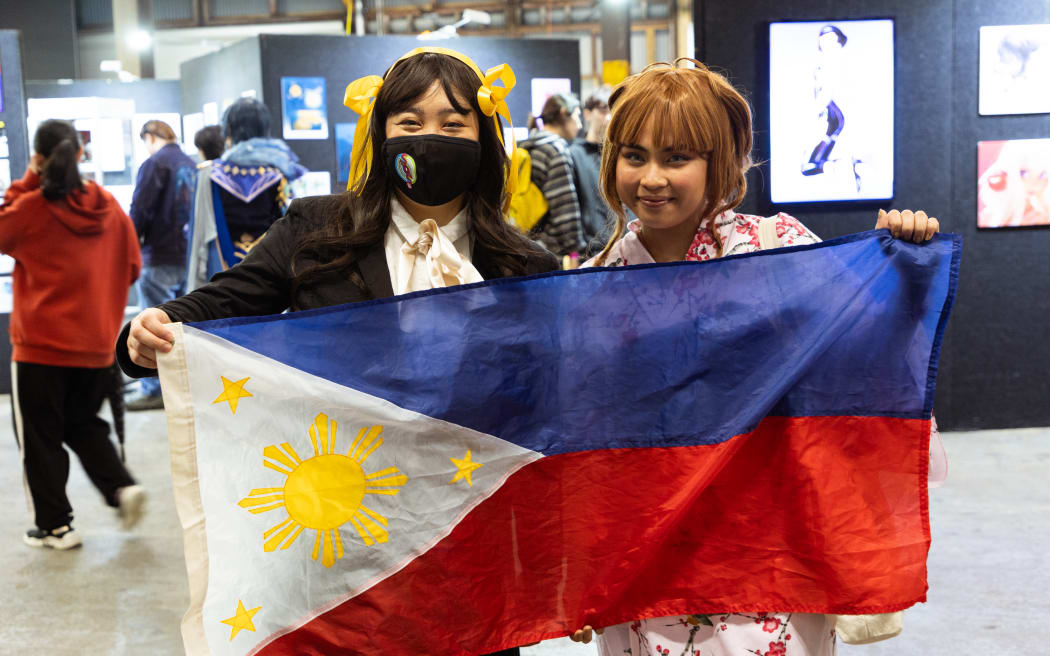 Filipino cosplayers Caryl Loria Illana and Clarydel Seviia at the Overload convention on April 27.