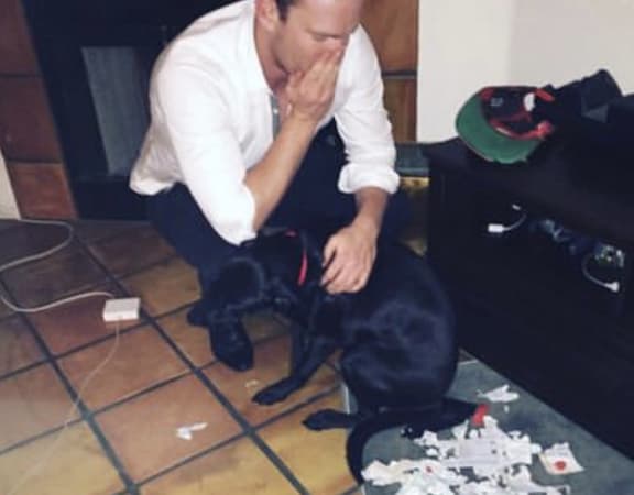 Andy Peat and his dog-chewed passport in 2015.