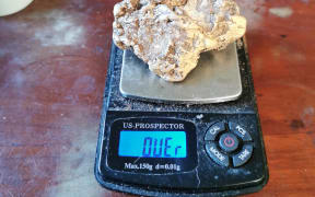 Craig Douglas' gold nugget on scales.