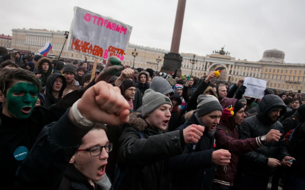 Opposition supporters participate in an anti-corruption rally in central Saint Petersburg.