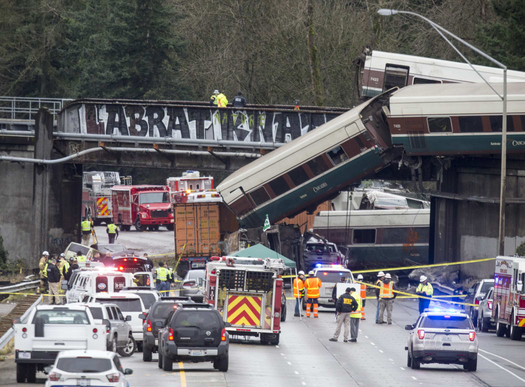 Emegency crews work at the scene of a Amtrak train derailment on December 18, 2017 in DuPont, Washington.