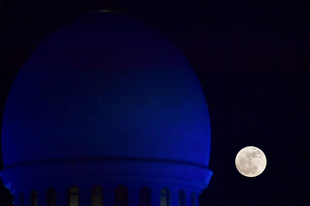 The supermoon behind the Sheikh Zayed Grand Mosque in Abu Dhabi.