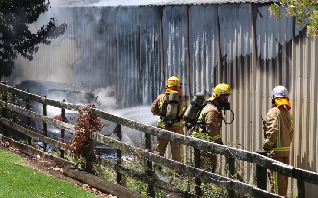 Kerikeri volunteer firefighters battle a major blaze at The Music Workshop on Waipapa Road on 24 October 2017.