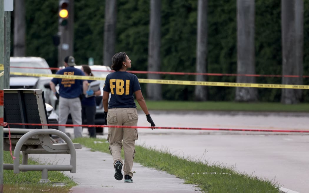 Law enforcement personnel investigate the area around Trump International Golf Club after an apparent assassination attempt of former President Donald Trump on September 15, 2024 in West Palm Beach, Florida. The FBI and U.S. Secret Service, along with the Palm Beach County Sheriff's office, are investigating the incident, which the FBI said "appears to be an attempted assassination of former President Trump" while he was golfing at the course.