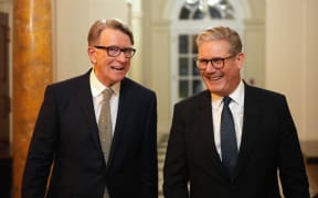 British Prime Minister Keir Starmer (R) talks with Britain's Ambassador to the United States Peter Mandelson during a welcome reception at the ambassador's residence on February 26, 2025 in Washington, DC. British Prime Minister Keir Starmer is on his first visit to Washington since US President Donald Trump returned to the White House. (Photo by Carl Court / POOL / AFP)