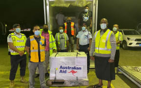 Australian and Fijian government officials at the Nadi International Airport after the arrival of 100,000 doses of the AstraZeneca vaccine.