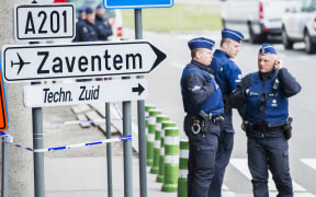 Police officers at the entrance of Brussels Airport, in Zaventem, Wednesday