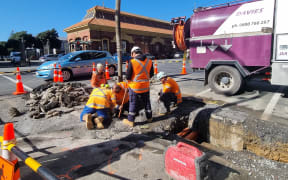 Workers carry out repairs at the corner of Johnson Street and Customhouse Quay, Wellington, after a burst pipe affected supply to at least 100 buildings.