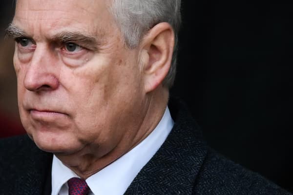 (FILES) Britain's Prince Andrew, Duke of York reacts as he leaves at the end of the Royal Family's traditional Christmas Day service at St Mary Magdalene Church in Sandringham, Norfolk, eastern England, on December 25, 2022. UK's scandal-hit Prince Andrew said on October 17, 2025, he is giving up his royal title. (Photo by Daniel LEAL / AFP)