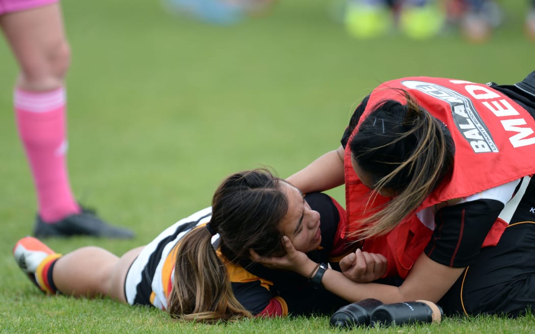 Stacey Waaka being checked for concussion during an NPC match for Waikato.