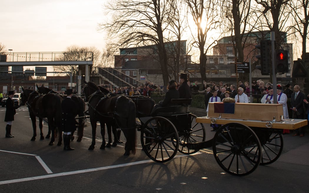 The oak coffin with the remains of King Richard III on a horse-drwan carriage in front of St Nicholas Church in Leicester.