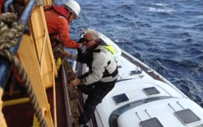 The surviving trio of the stricken yacht Platino is safely back in New Zealand and heaping praise on the crew of their rescuers.