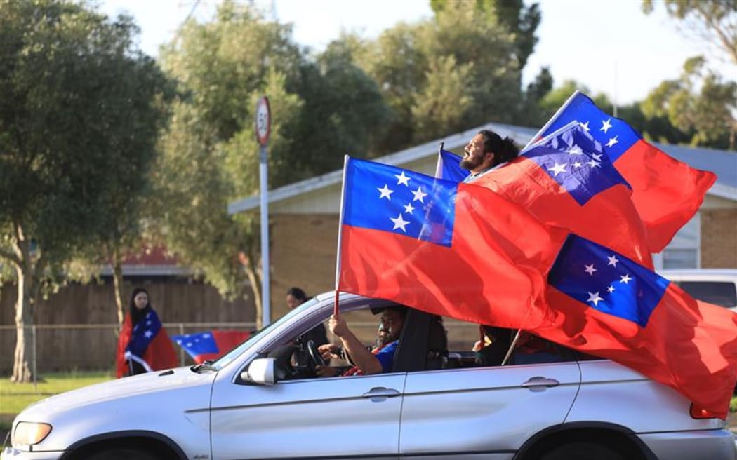 Samoa fans following the World Cup final, in Otara, Auckland