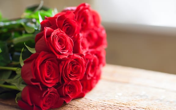 Red roses bouquet. Flowers. Romantic background