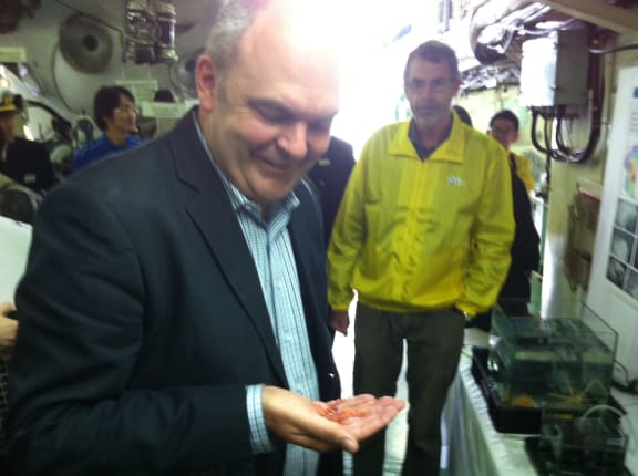 Science and Innovation Minister Steven Joyce holds one of species found near underwater mountains in the northern Kermadec Arc.