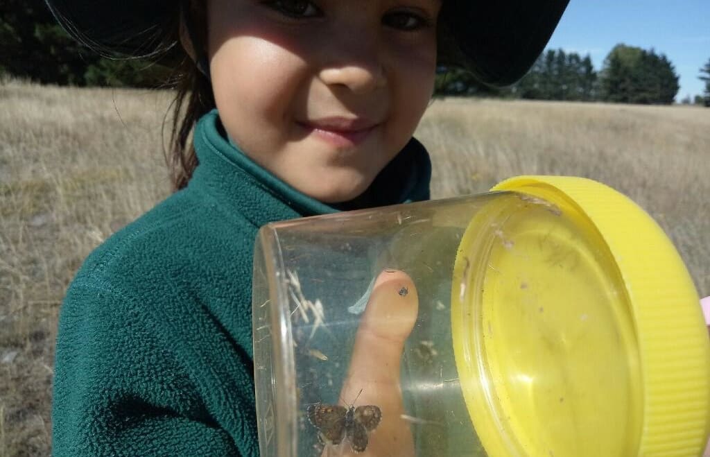 Burnside Primary student Valentina, with a Boulder Butterfly.