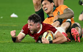 Hugo Keenan of the Lions reacts after scoring a try to win the second test against the Wallabies in Melbourne.