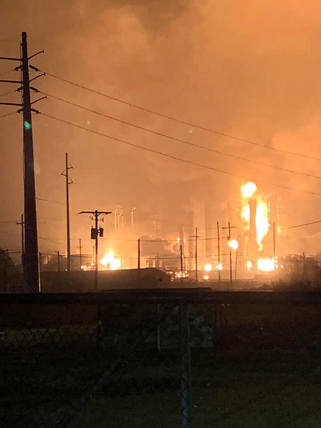 This handout image taken early on November 27, 2019 and released to AFP by Ryan Mathewson, who lives roughly two minutes from the plant with his family, shows fire and flames following an explosion at a chemical plant in the Texas city of Port Neches, east of Houston.