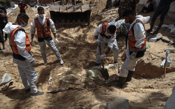 Health workers unearth bodies found at Nasser Hospital in Khan Yunis in the southern Gaza Strip on April 23, 2024 amid the ongoing conflict between Israel and the Palestinian militant group Hamas. (Photo by AFP)