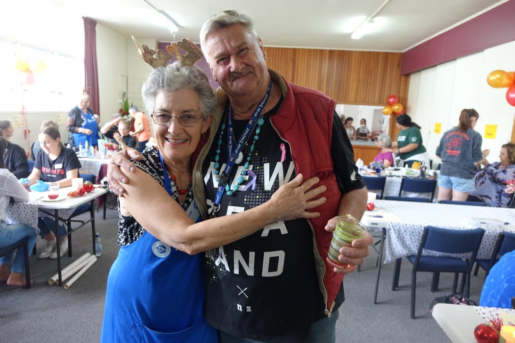 Gabrielle Carman with community dinner regular Ken Ranford.