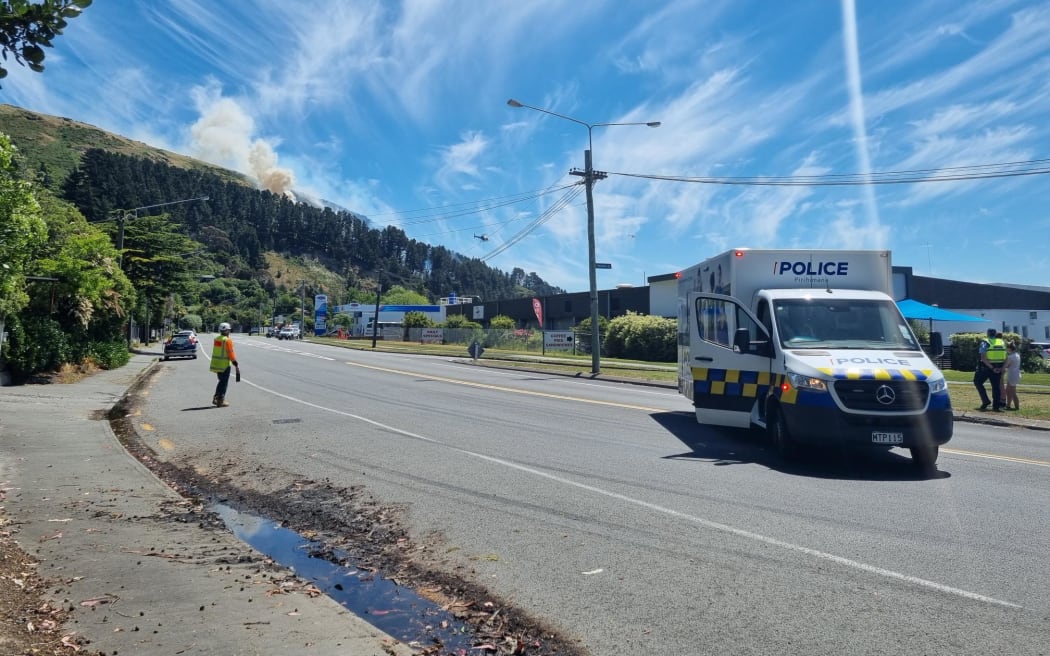 A view of the fire on 20 November 2023 from Port Hills Road. Helicopters circling and dumping water.