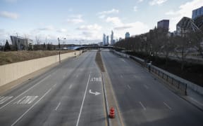 Columbus Drive is seen empty in downtown Chicago, Illinois, on March 21, 2020.