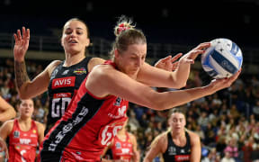 Ellie Bird controls the ball for the Tactix under challenge from Georgia Tong of the Magic during the ANZ Premiership netball match in  Christchurch, 7 July 2025. Copyright photo: John Davidson / www.photosport.nz
