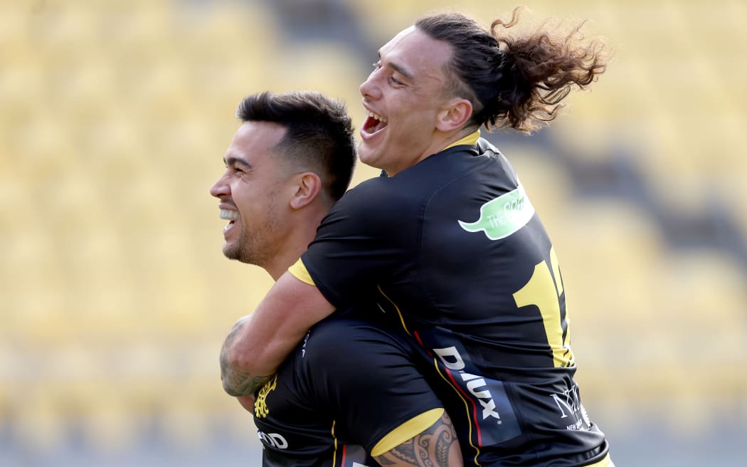 Brandyn Laursen (L) celebrates scoring a try with Thomas Umaga-Jensen during the Bunnings NPC rugby match between the Lions and Northland at Sky Stadium in Wellington. 7 August 2021.