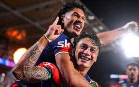 Charnze Nicoll-Klokstad of the Warriors celebrates his try with Dallin Watene-Zelezniak of the Warriors, NZ Warriors v Sydney Roosters, round 1 NRL Telstra Premiership rugby league match at Go Media Stadium.