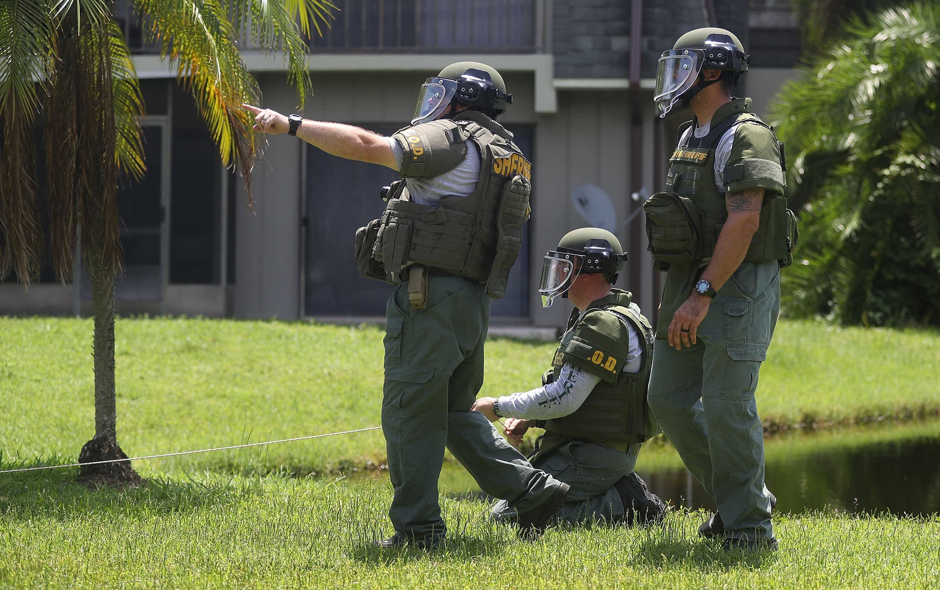 A Bomb Disposal Unit checks for explosives around the apartment building where shooting suspect Omar Mateen is believed to have lived on June 12, 2016 in Fort Pierce, Florida.