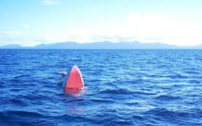 The tip of a submerged boat that sank near Bungana in Solomon Islands on 25 June 2019. 20 people were rescued by the 26th but two men are still missing.