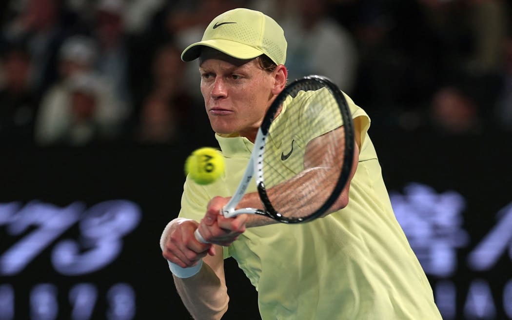 Italy's Jannik Sinner hits a shot against USA's Ben Shelton during their men's singles semi-final match on day thirteen of the Australian Open tennis tournament in Melbourne on January 24, 2025.