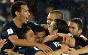 Auckland City FC players celebrate their historic win.