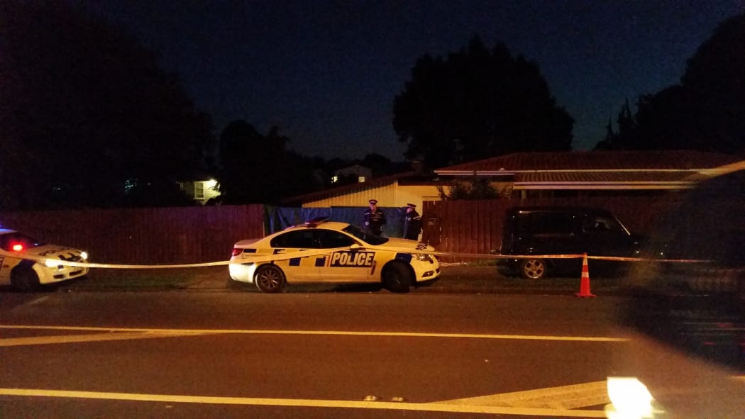 Police guard the scene in Mangere, South Auckland, where a toddler was found dead.