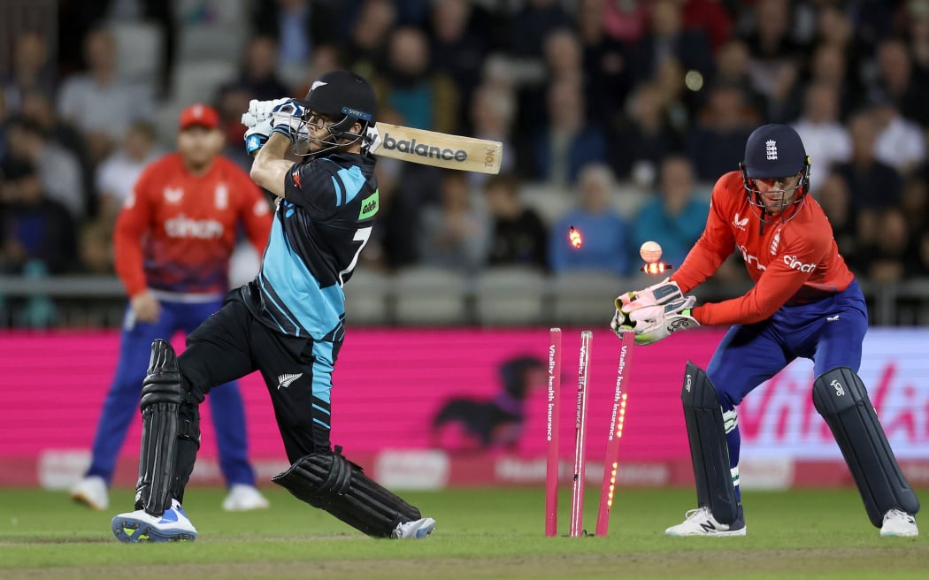 Mitchell Santner of New Zealand is bowled out by Liam Livingstone of England in the second T20 International cricket match at Old Trafford.