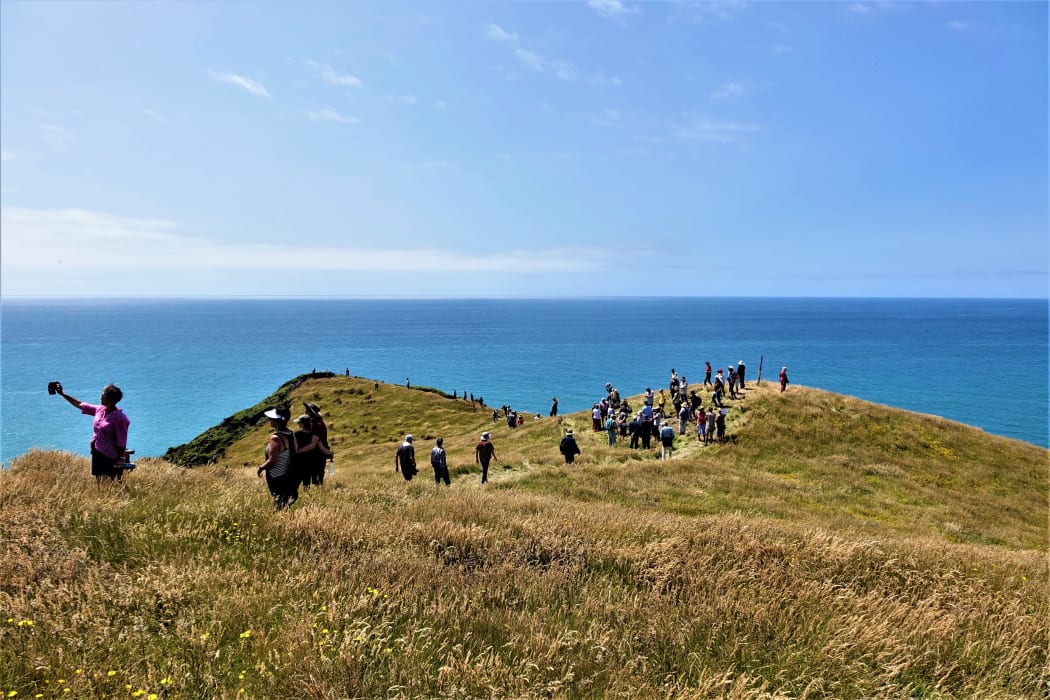 Guests at the opening ceremony take a walk through the sanctuary at Cape Farewell.