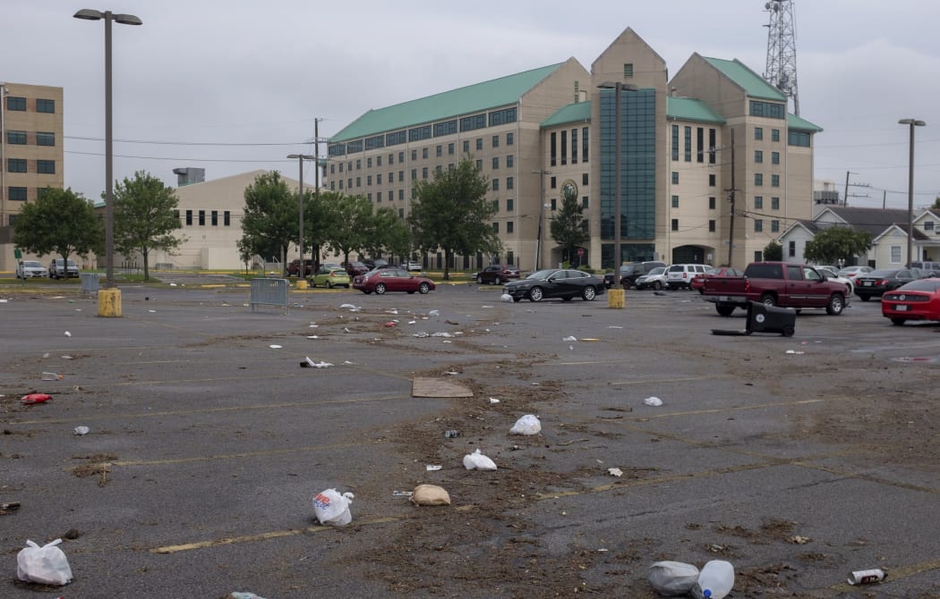 Debris is strewn across a parking lot in New Orleans after flash floods struck the area early on July 10, 2019.