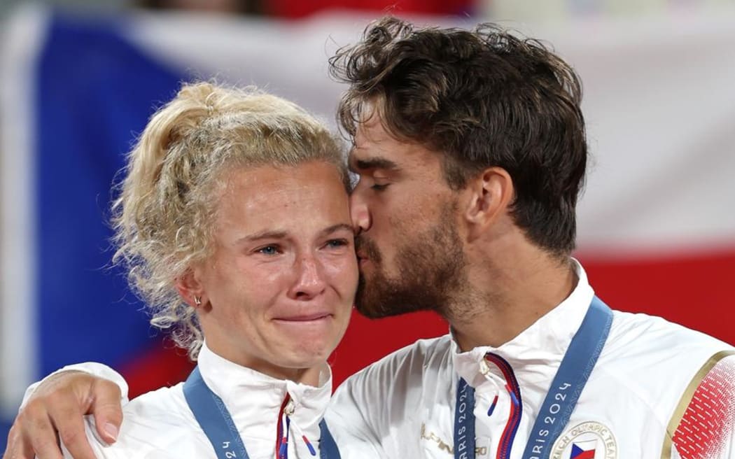 Katrina Siniakova and Tomas Machac at the tennis mixed doubles medal ceremony.