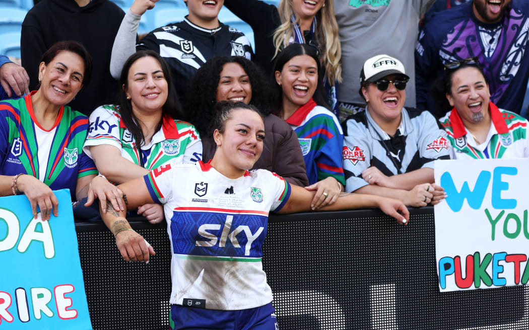 Marine Puketapu of the Warriors poses with with her supporters in the crowd after the Sydney Roosters Women v NZ Warriors Women.