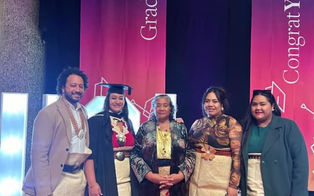Louise (second from left) with her family at her graduation.