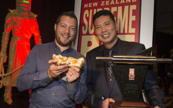 Jude Mark South holds Patrick Lam's Super Award winning pie.