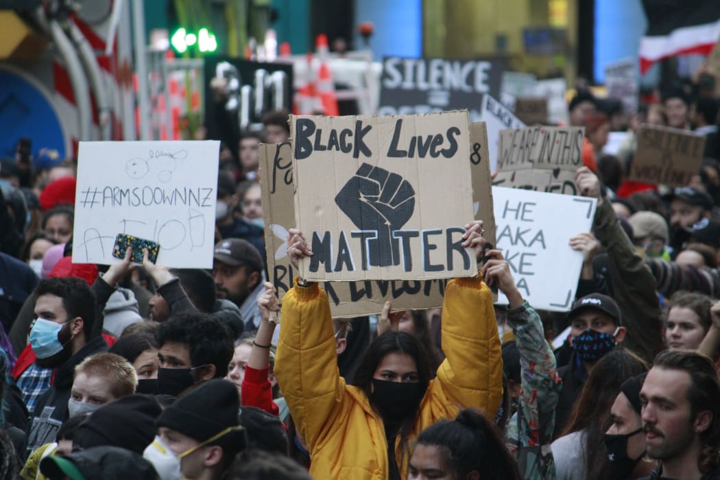 A protester holds a placard at the George Floyd / Black Lives Matter Auckland march on 1 June 2020.